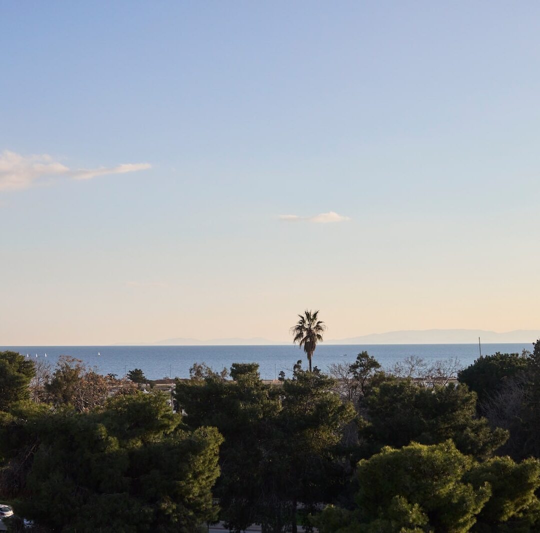 A picturesque sea view, featuring calm waters and a sunny atmosphere.