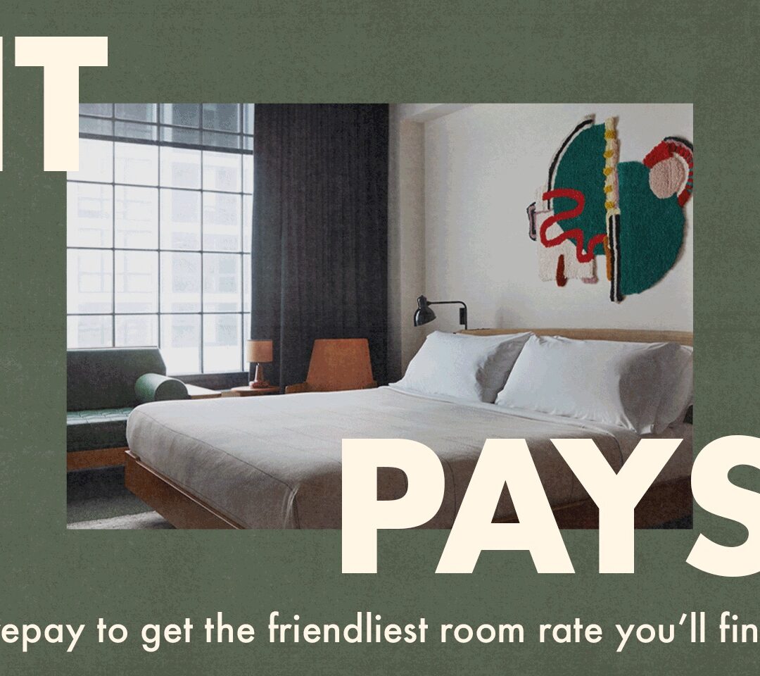 Minimalist hotel room with a large bed, modern decor, and text promoting prepaid room rates for better prices.