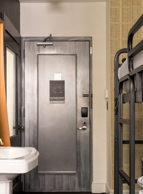 A cozy room features a sink and private toilet area