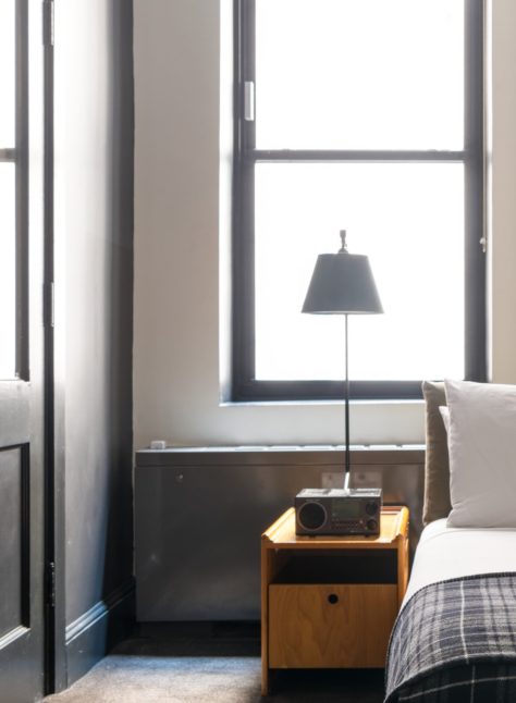 A room with a modern style features a window providing natural light
