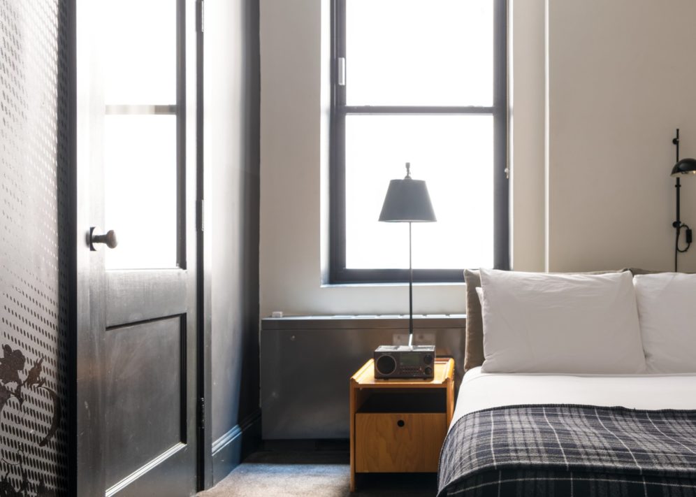 A room with a modern style features a window providing natural light
