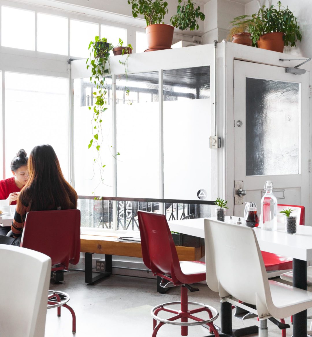 Two women eating a meal in a restaurant