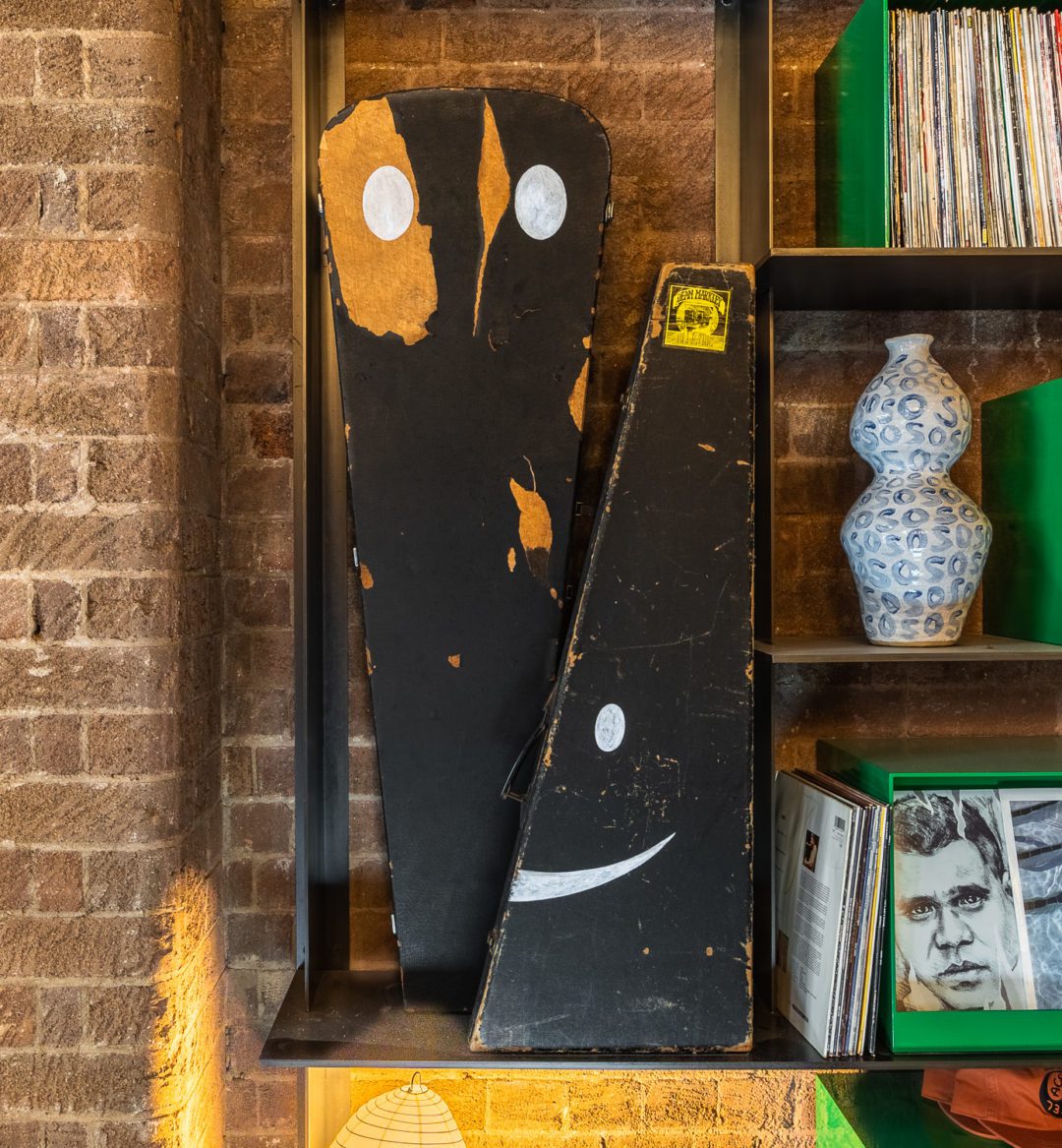 Two guitar cases with artwork on them